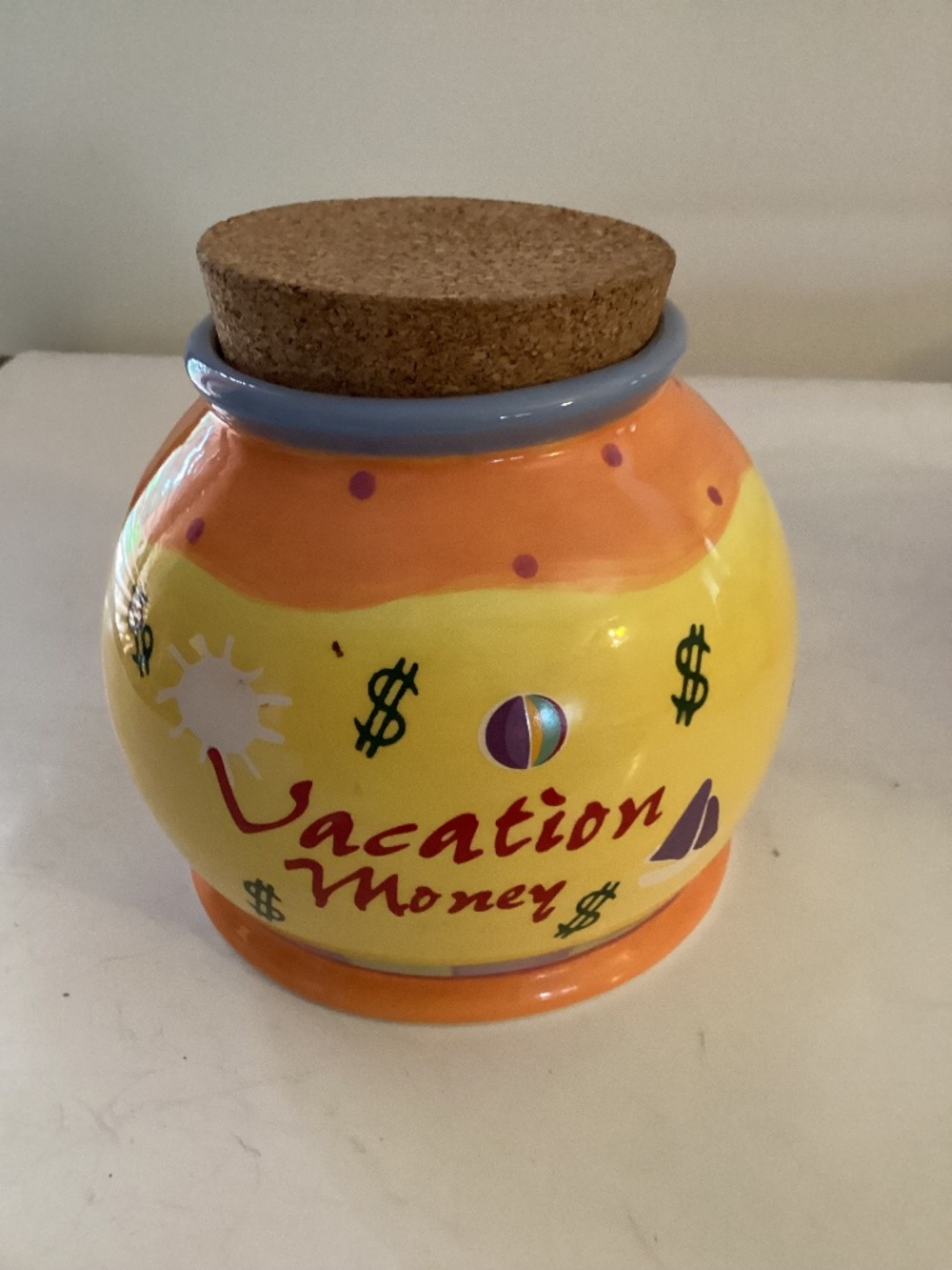 Ceramic “Vacation” money jar in yellow with cork stopper